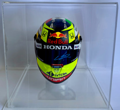 Mini casco de Fórmula 1 autografiado por Checo Pérez Mendoza